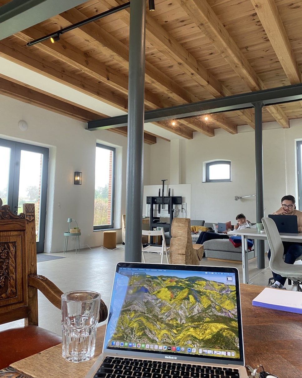 Remote work environment with team members working from a beautiful space